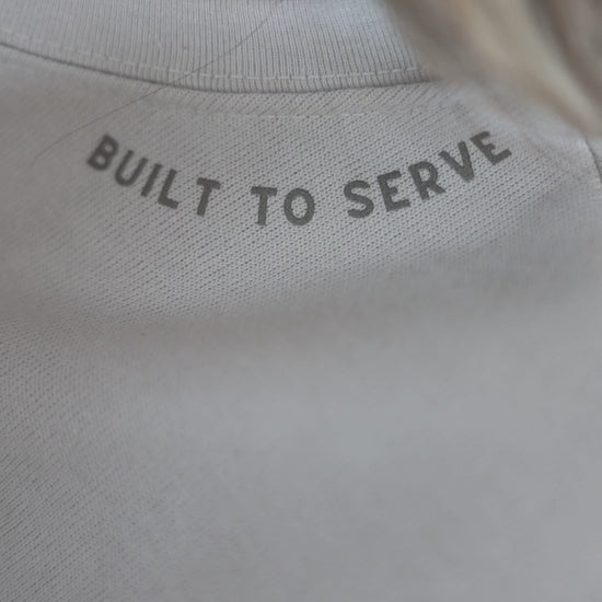 Video of a sweatshirt with Built to Serve on the neckline