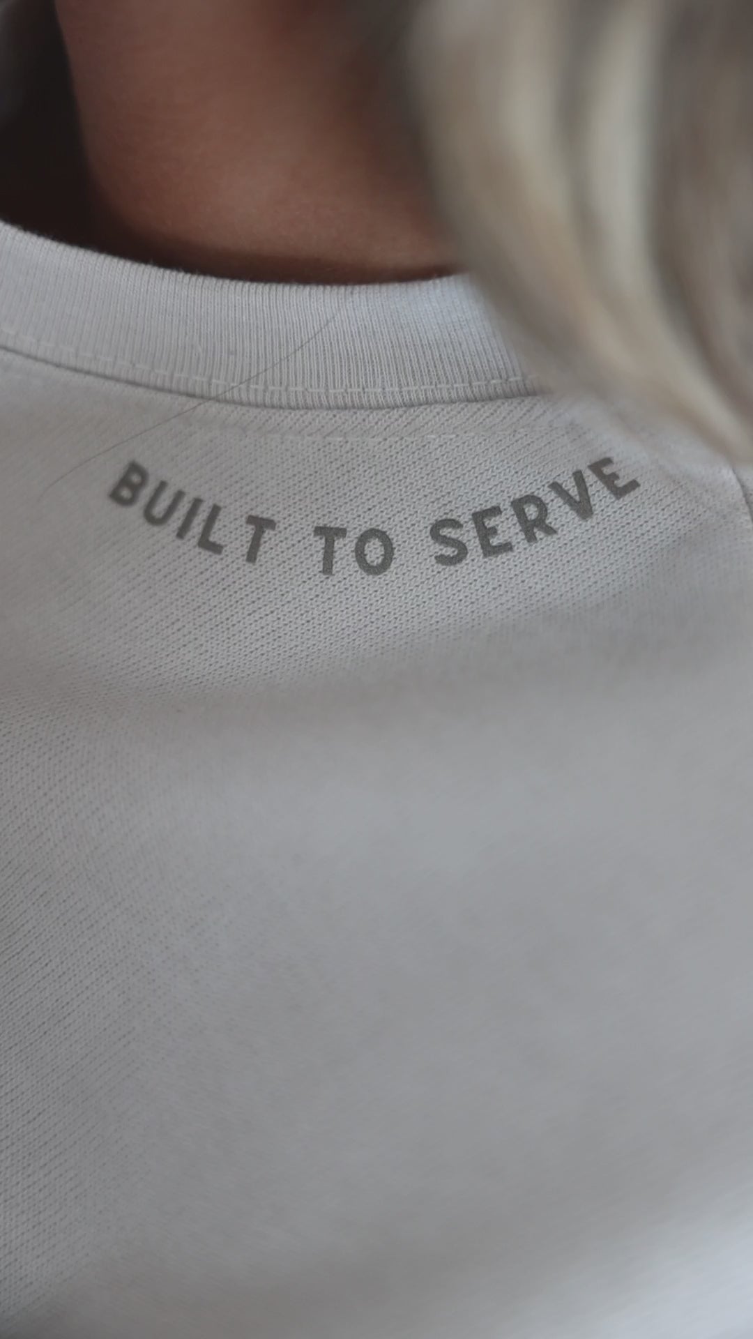 Video of a sweatshirt with Built to Serve on the neckline